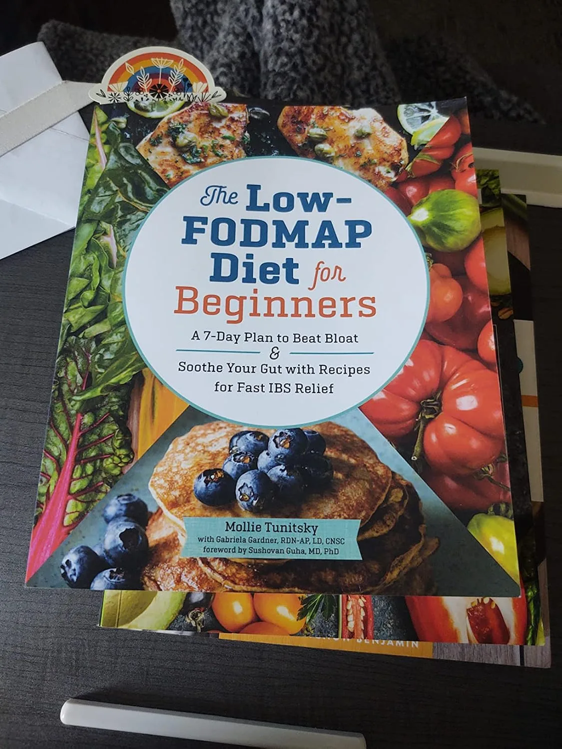 Customer photo of IBS Explained book showing the back cover and spine details