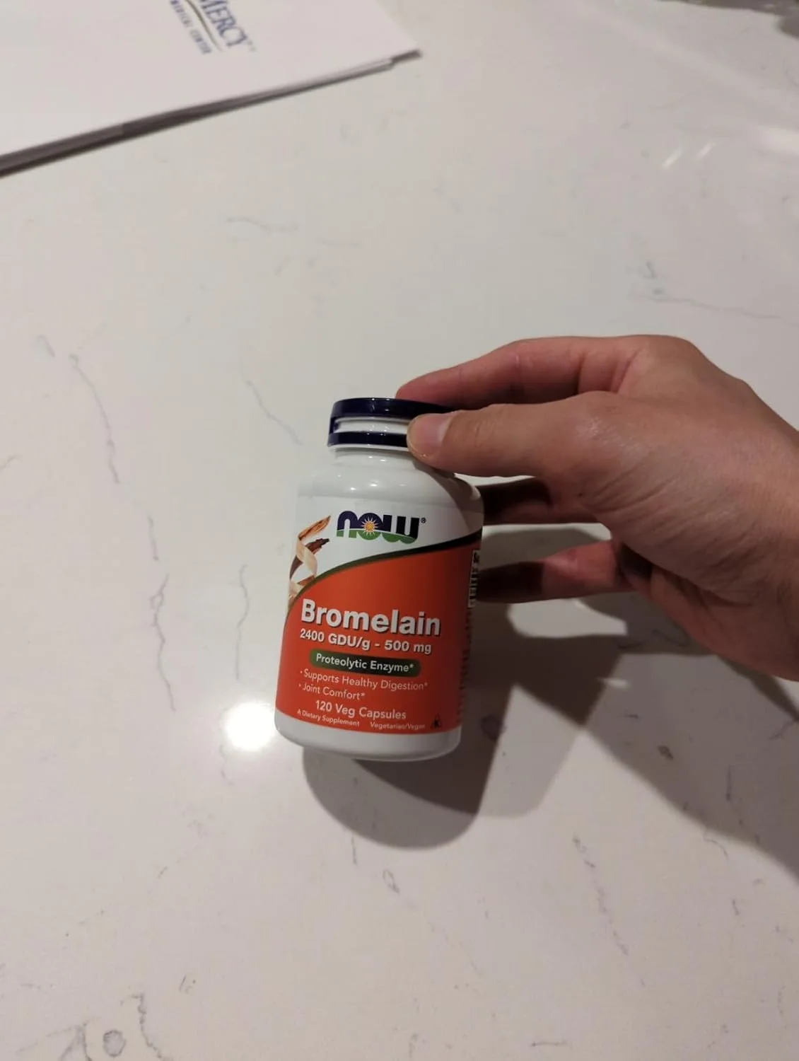Customer photo of digestive enzyme supplement capsules in bottle