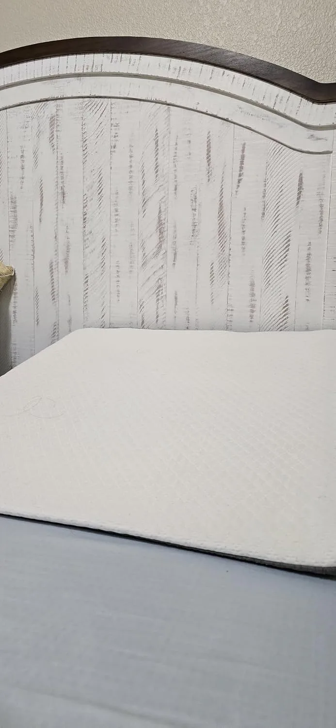 Customer photo of wedge pillow positioned on bed at an elevated angle for acid reflux relief