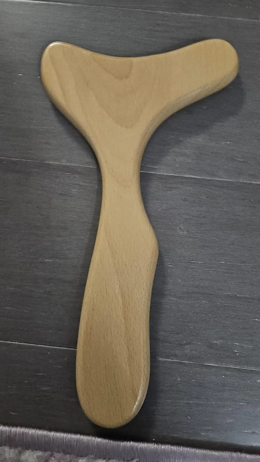 Customer photo of abdominal self-massage tool showing the device's design and size