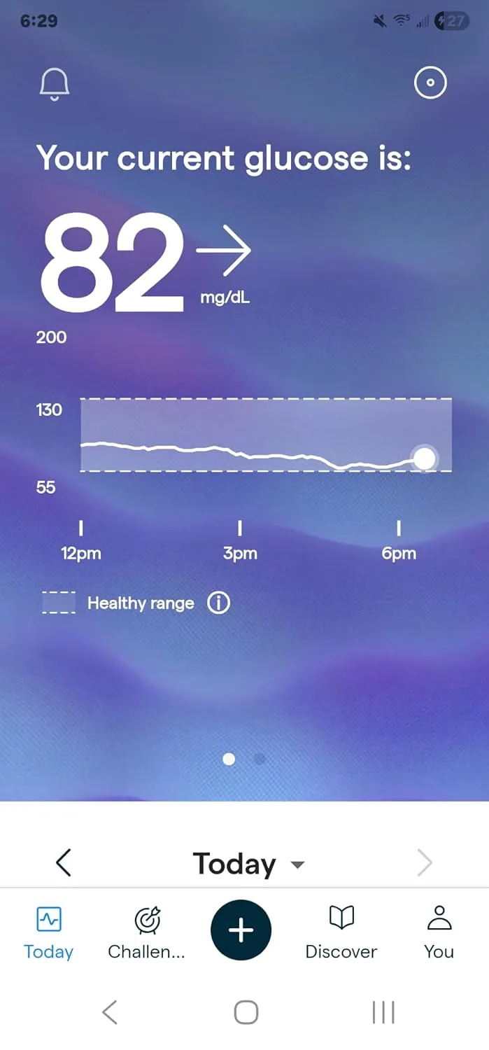 Customer photo showing continuous glucose monitor sensor application on arm skin