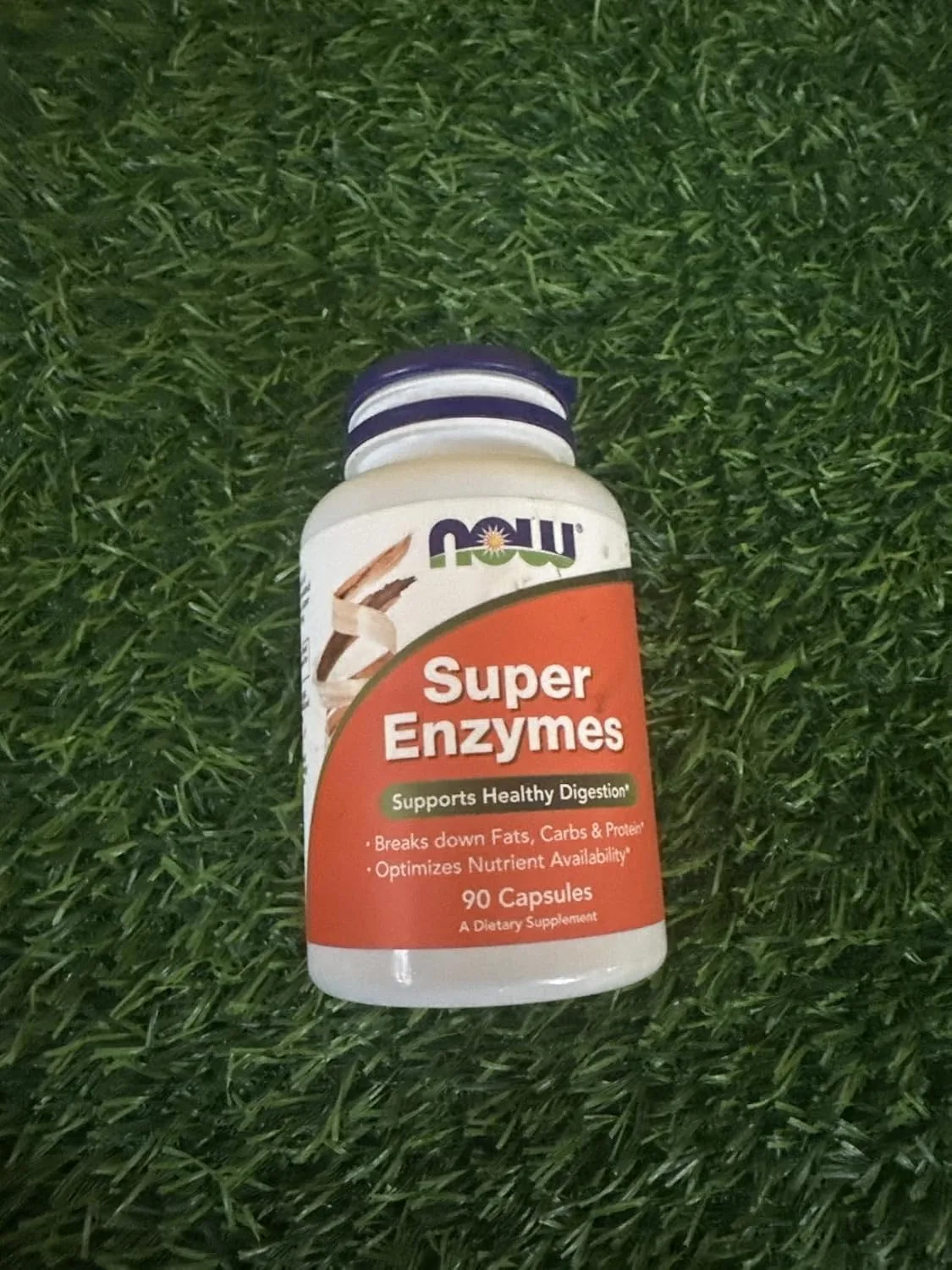 Customer photo of digestive enzyme supplement bottle and capsules displayed together
