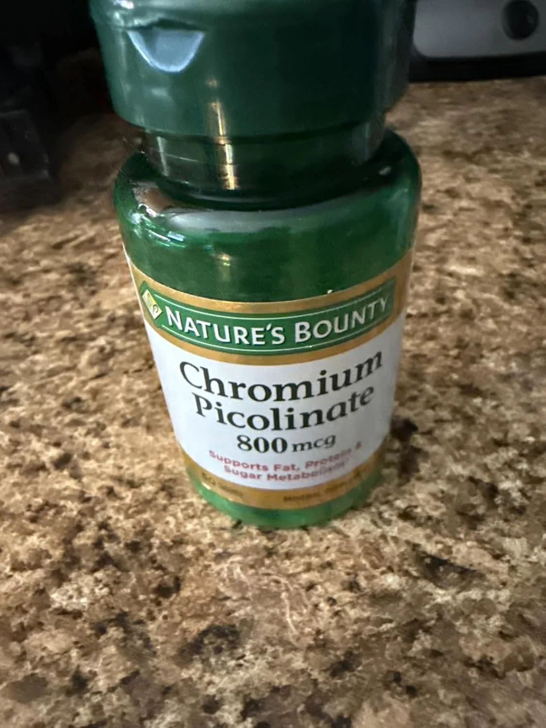 Customer photo showing chromium picolinate supplement bottle and capsules displayed together