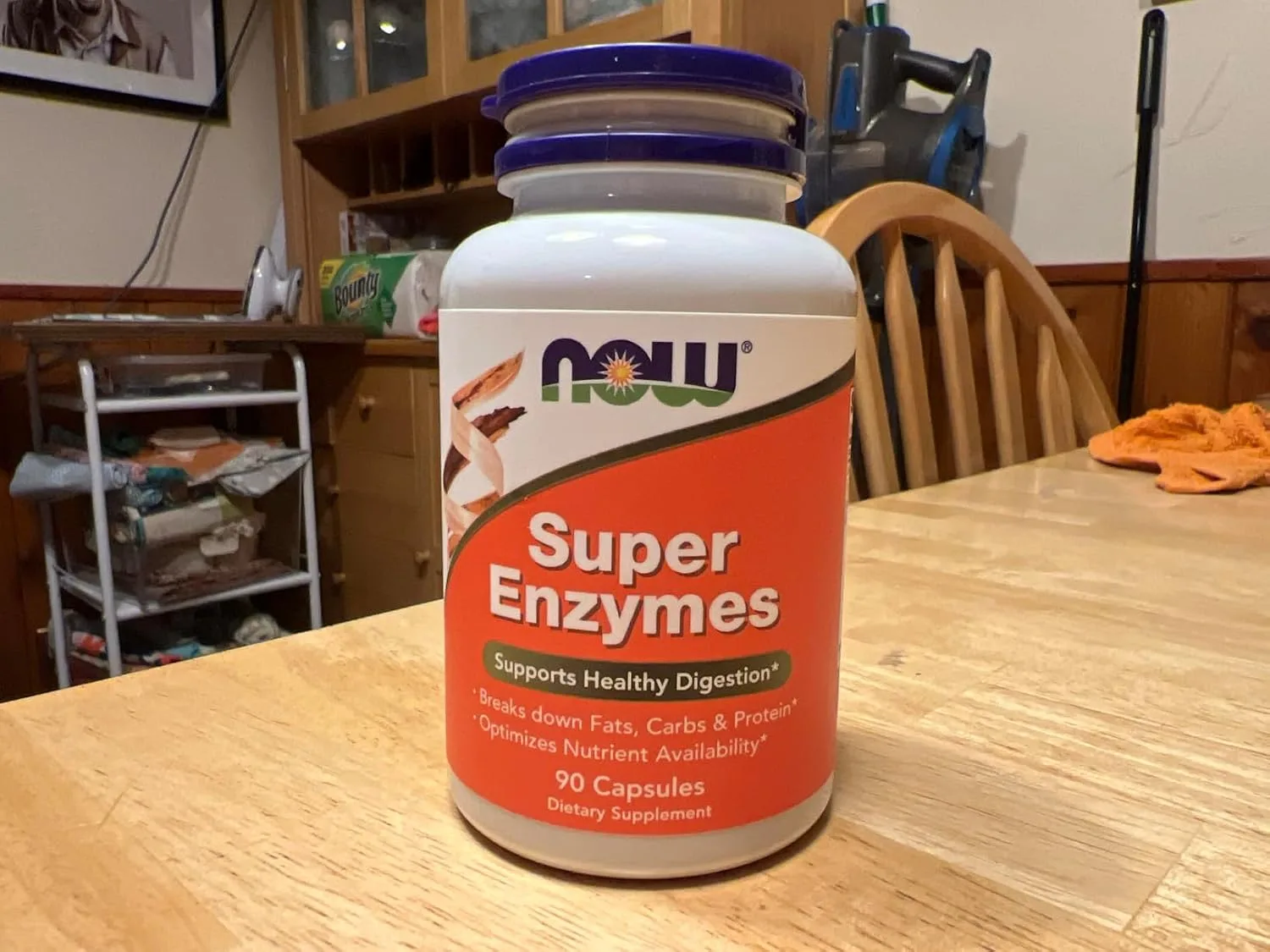 Customer photo of NOW Super Enzymes bottle showing label and supplement capsules