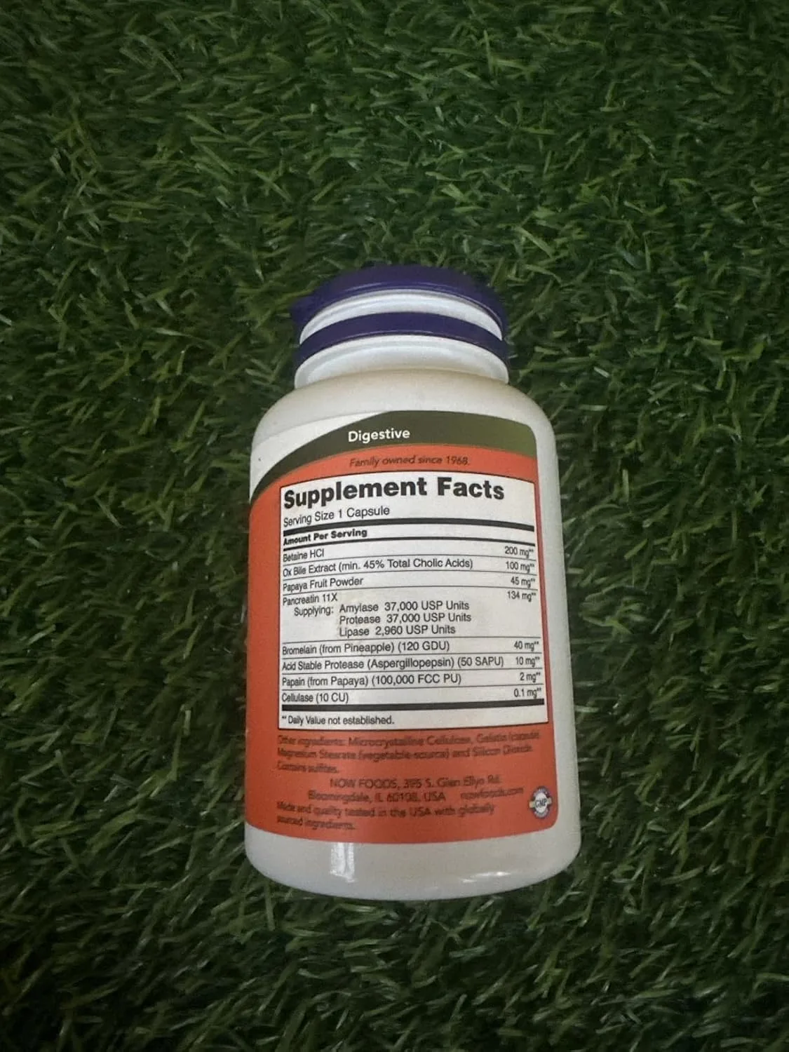 Customer photo of NOW Super Enzymes supplement bottle and capsules displayed together