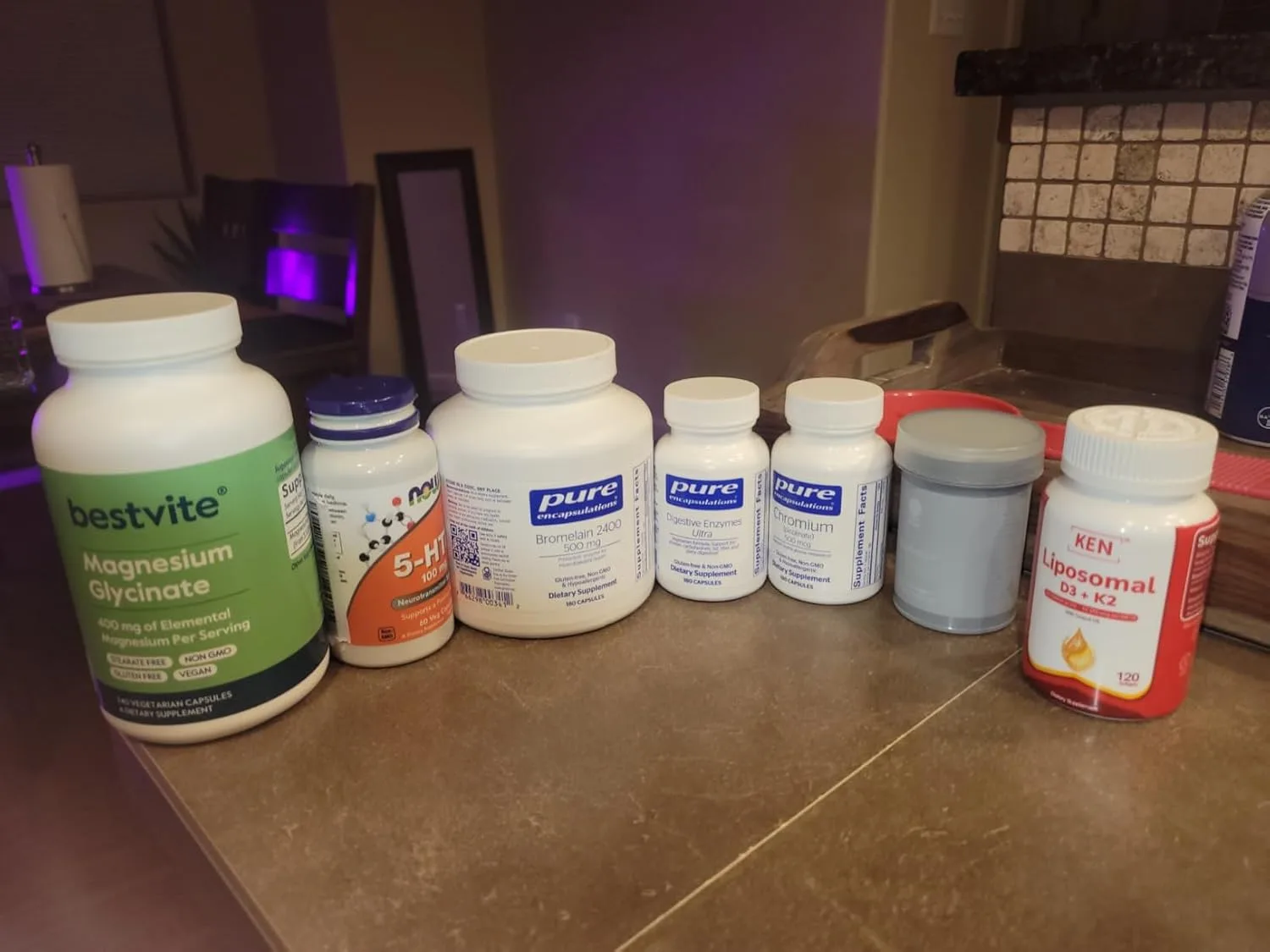 Customer photo of digestive enzyme supplement bottle displayed on white surface
