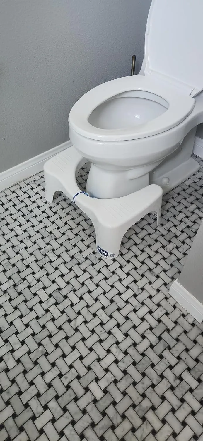 Customer photo of the squat toilet stool positioned in front of a toilet