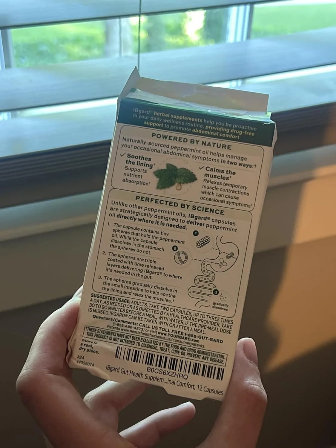 Customer photo showing digestive supplement packaging and contents displayed on white surface