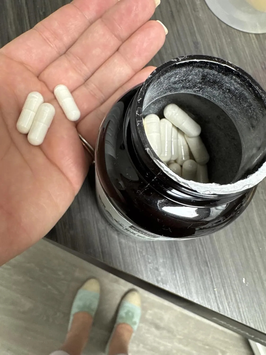 Customer photo of probiotic supplement bottle and packaging displayed on white surface