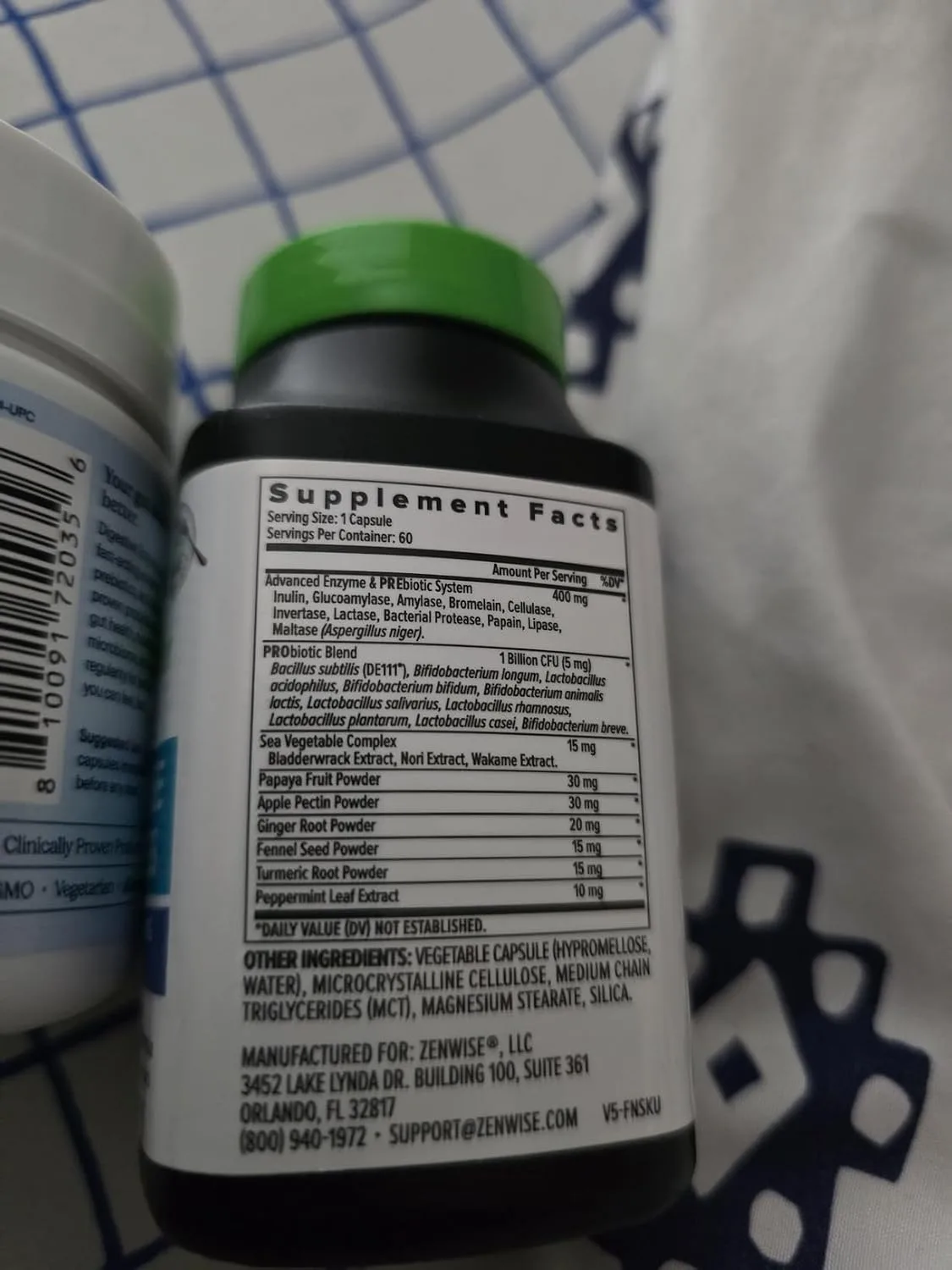 Customer photo of digestive enzyme supplement bottle displayed next to a meal