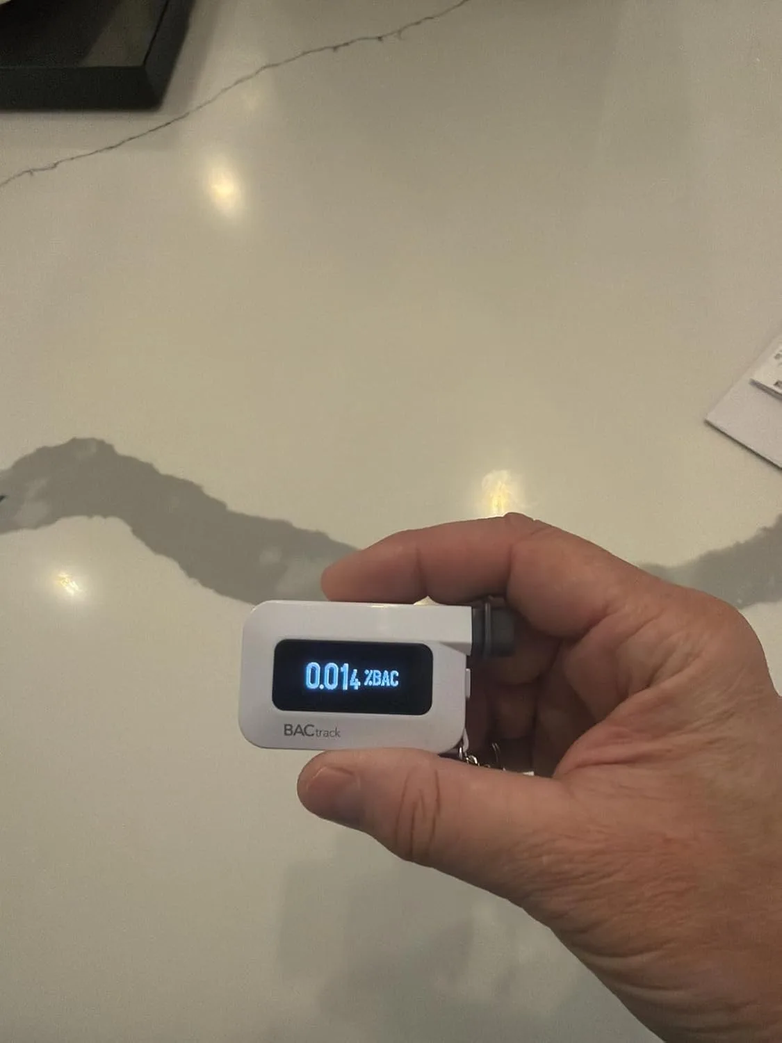 Customer photo of FoodMarble AIRE 2 device displaying breath test results on screen