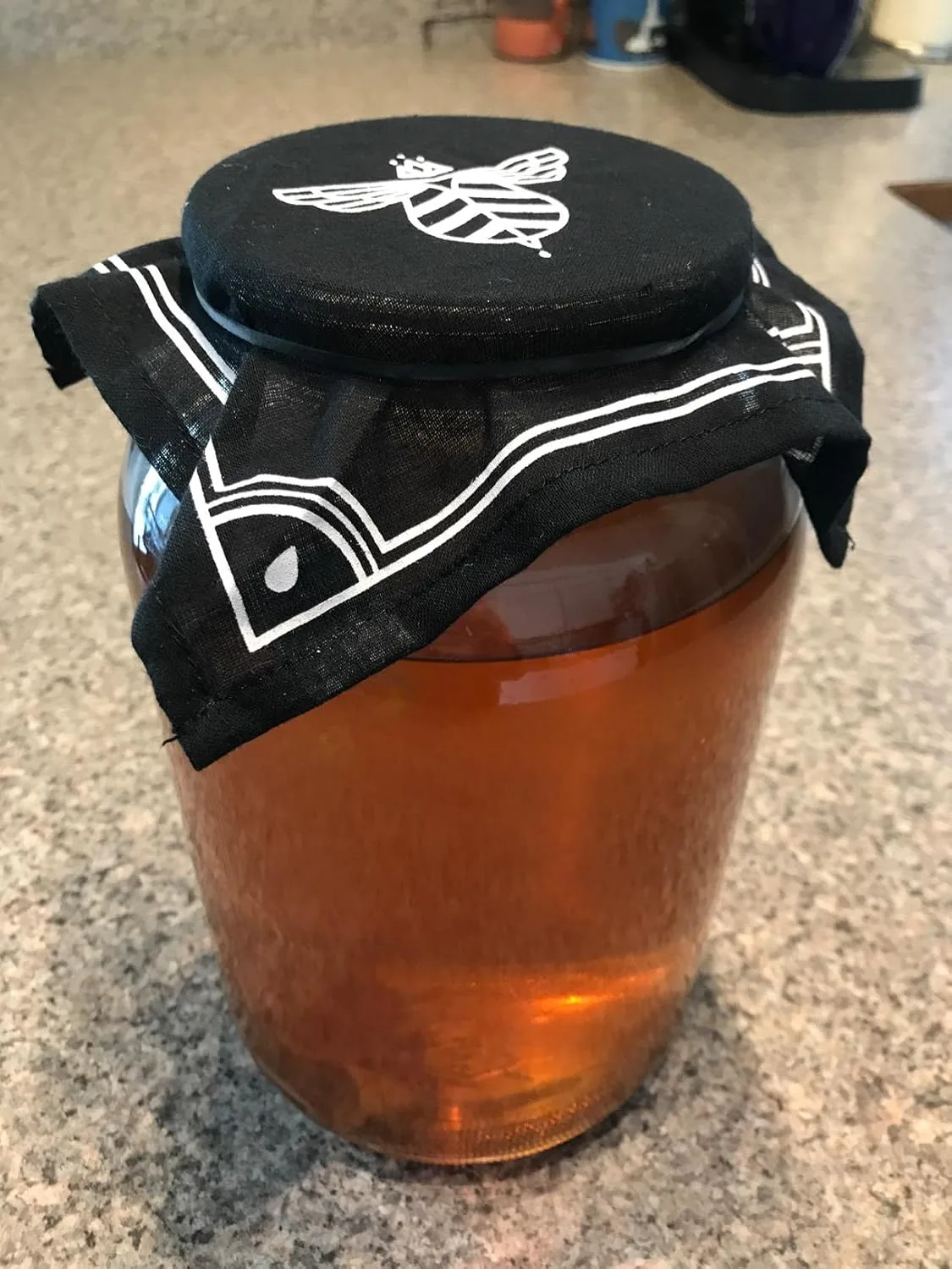 Customer photo of kombucha bottle showing carbonation level and clarity