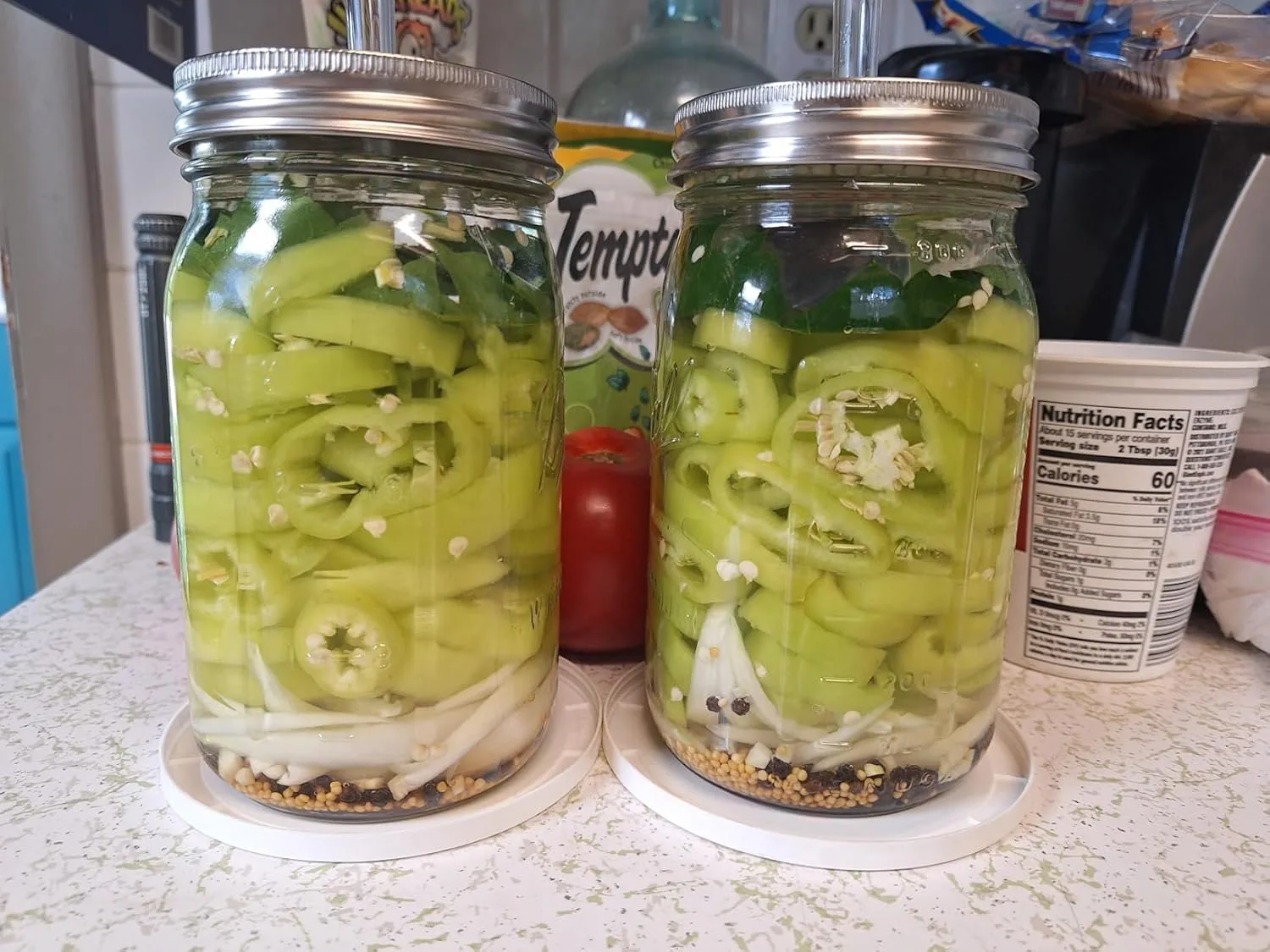 Customer photo of finished homemade sauerkraut in a glass jar showing fermented cabbage