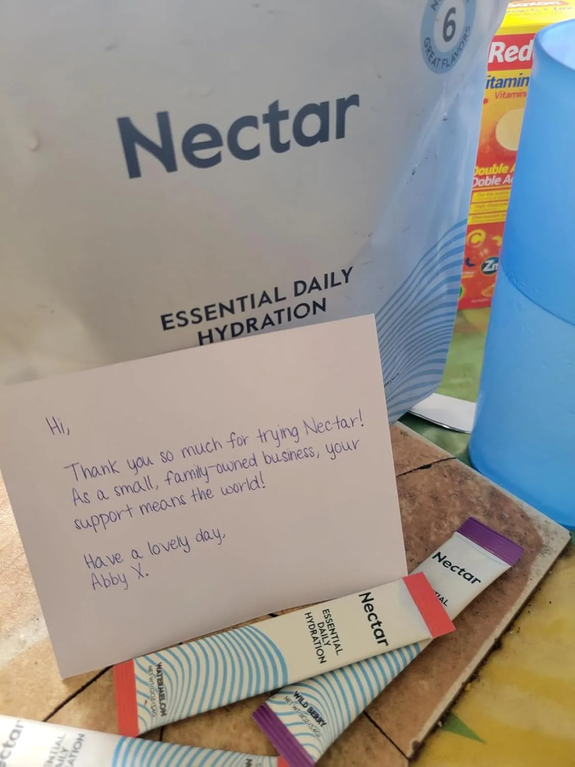 Customer photo of hydration drink solution in clear measuring cup during colonoscopy prep