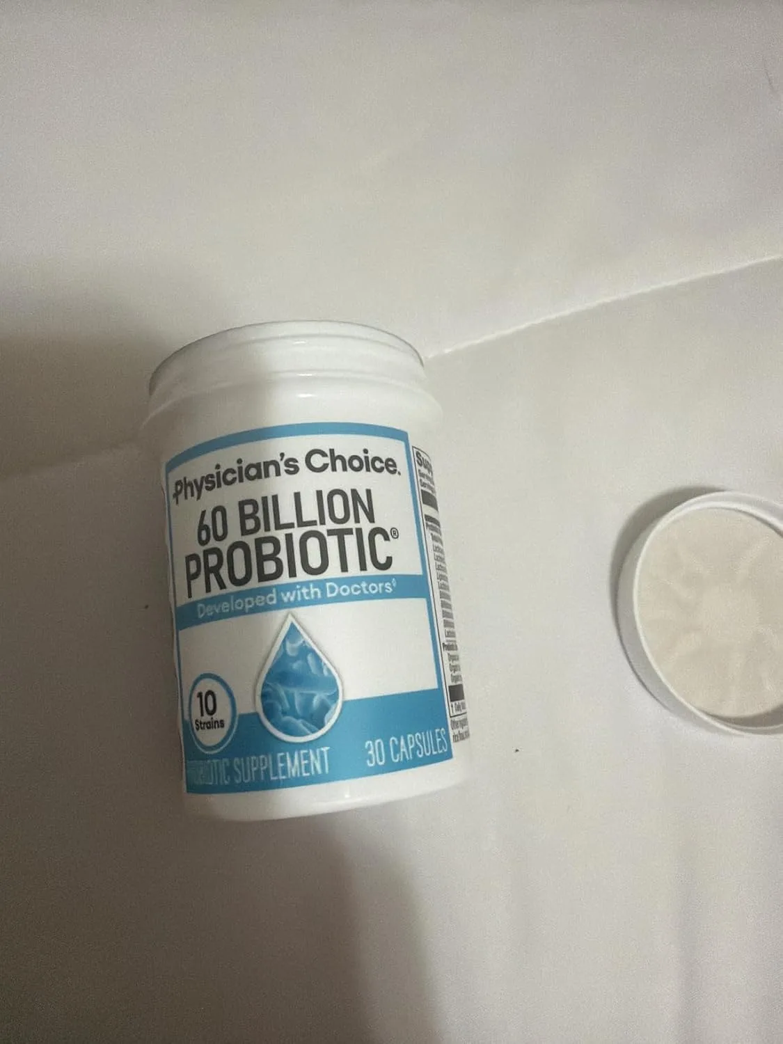 Customer photo of probiotic supplement bottle with capsules displayed