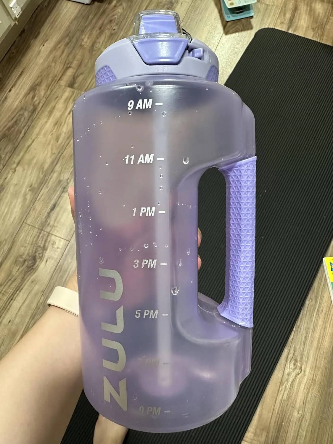 Customer photo of water bottle filled with clear water showing hydration tracking