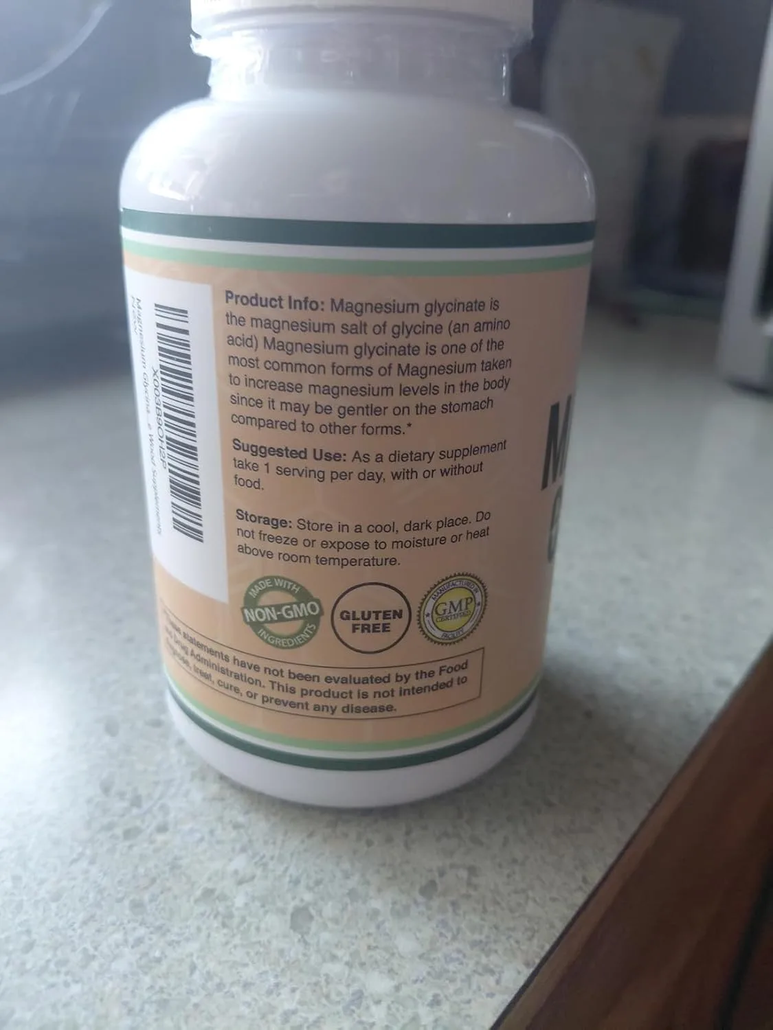 Customer photo of magnesium supplement bottle with dosage information and ingredient label visible