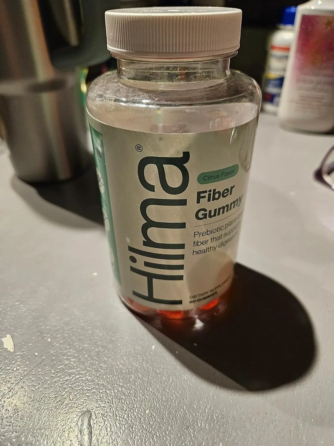 Customer photo of IBS relief supplement bottle displayed on white surface
