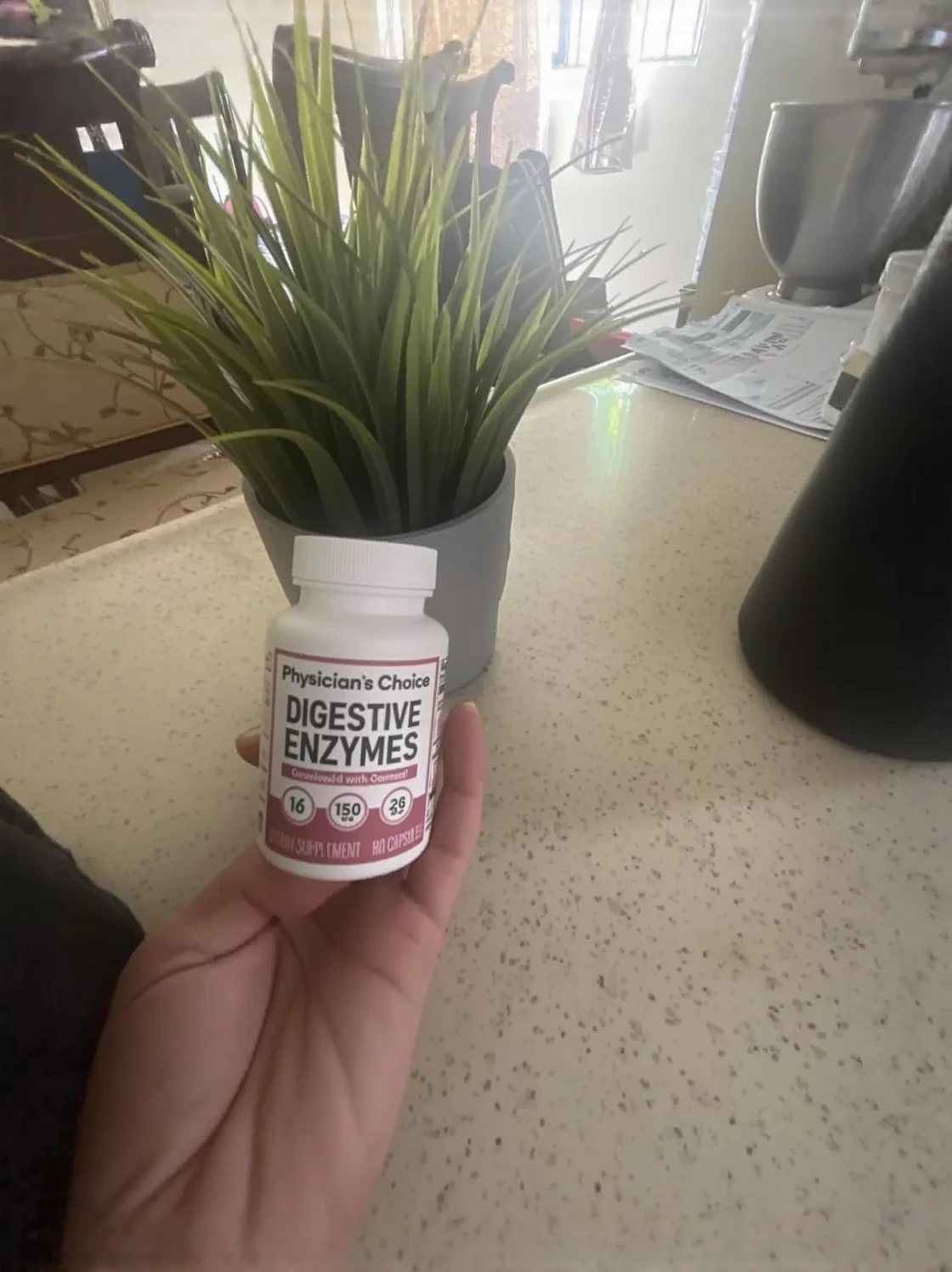 Customer photo of bloating relief supplement bottle showing product packaging and label details