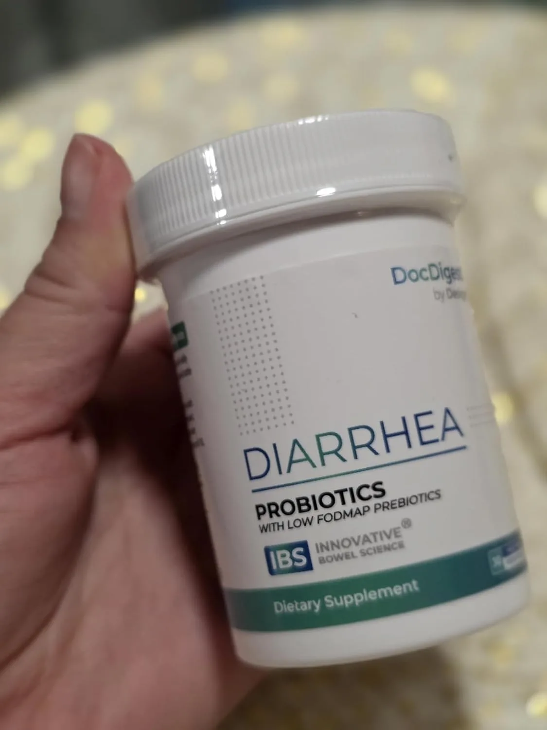Customer photo of IBS relief supplement bottle with product packaging and informational materials displayed