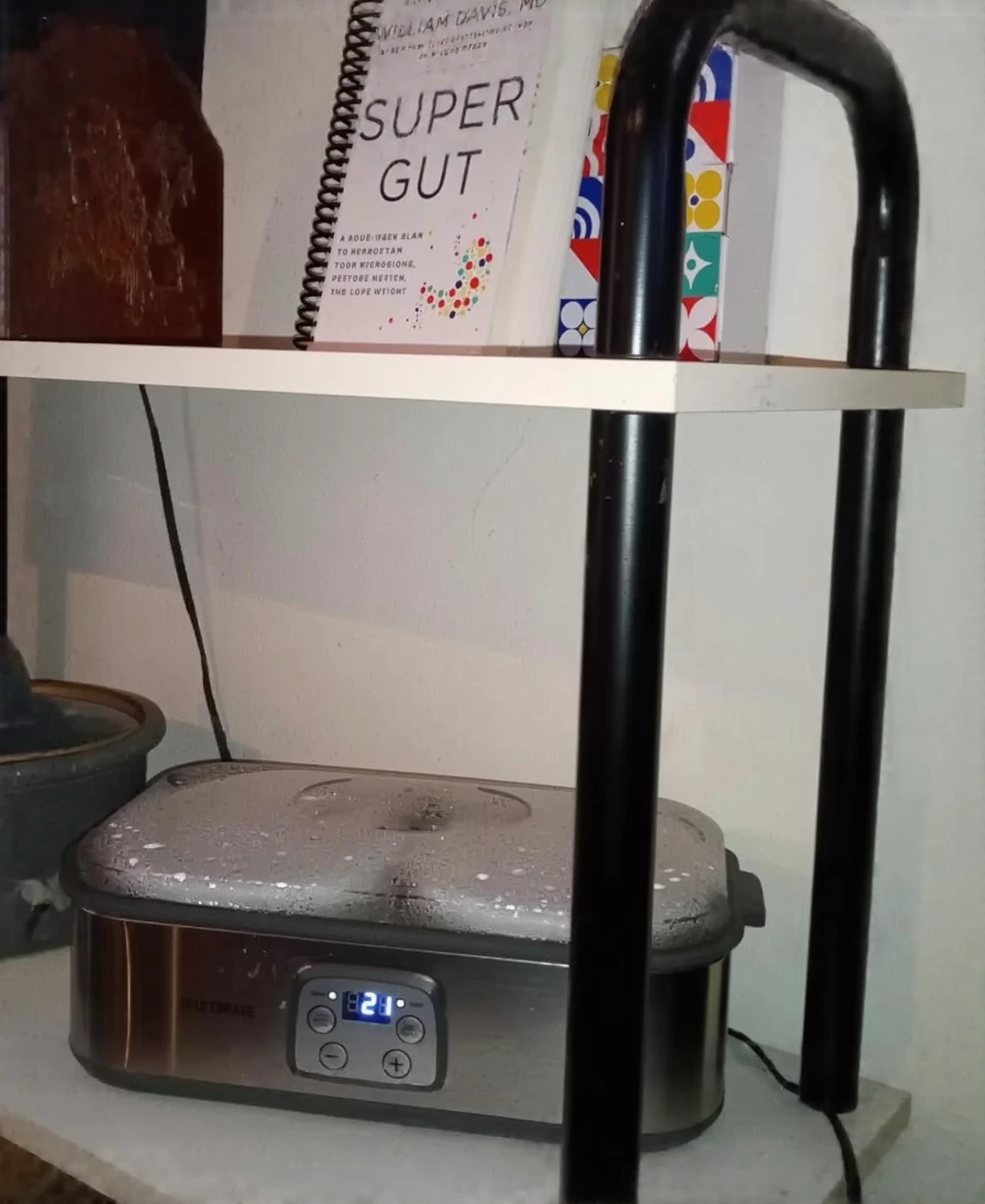 Customer photo of yogurt maker displaying multiple glass jars filled with homemade yogurt